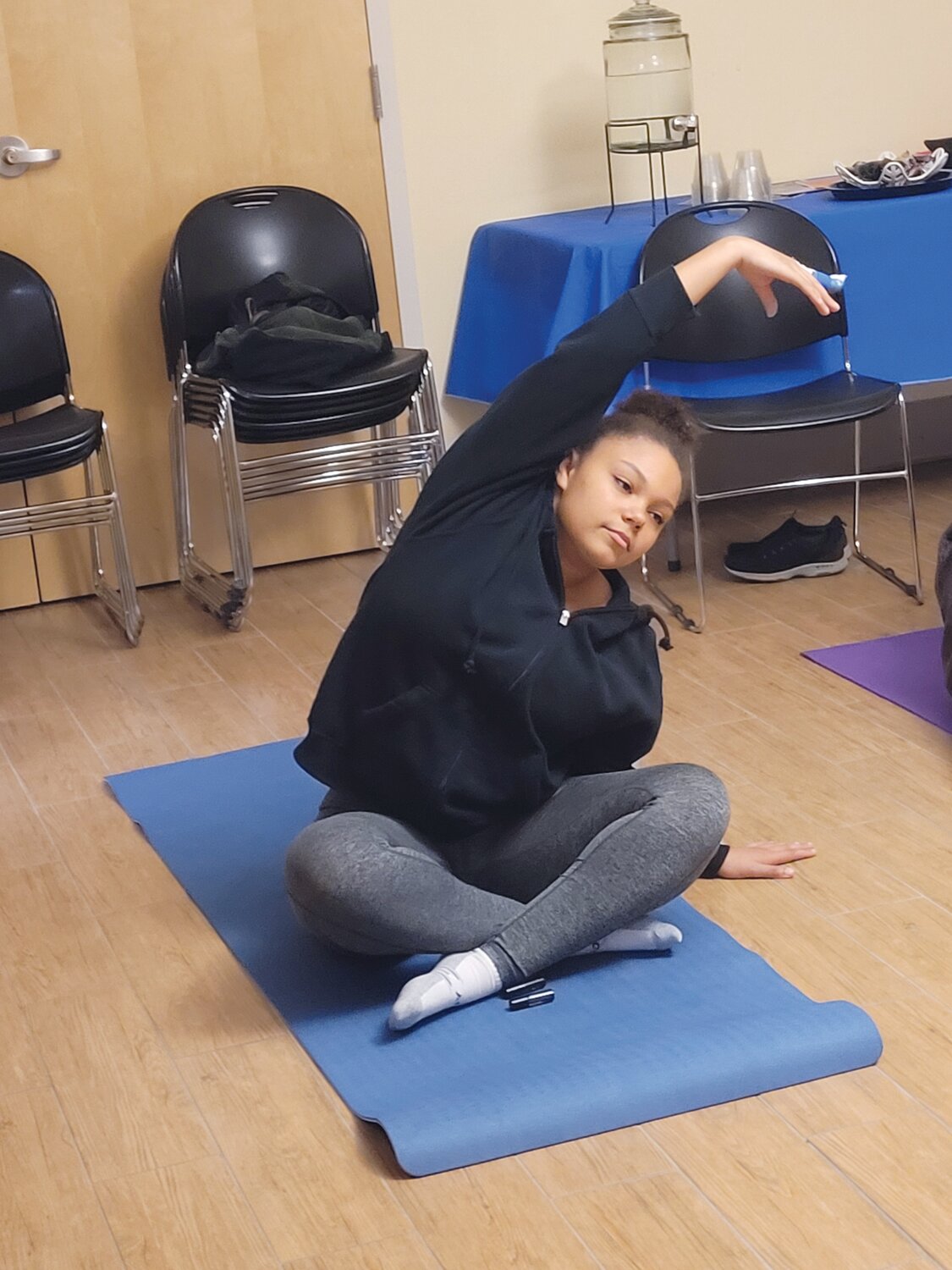 YOUNG YOGI: Johnston High School senior Jenna Asselin designed a 10-week yoga course as part of her senior project. She hopes to share the calming habits of yoga 
with her fellow students, who seem to be 
suffering from anxiety
more than ever.